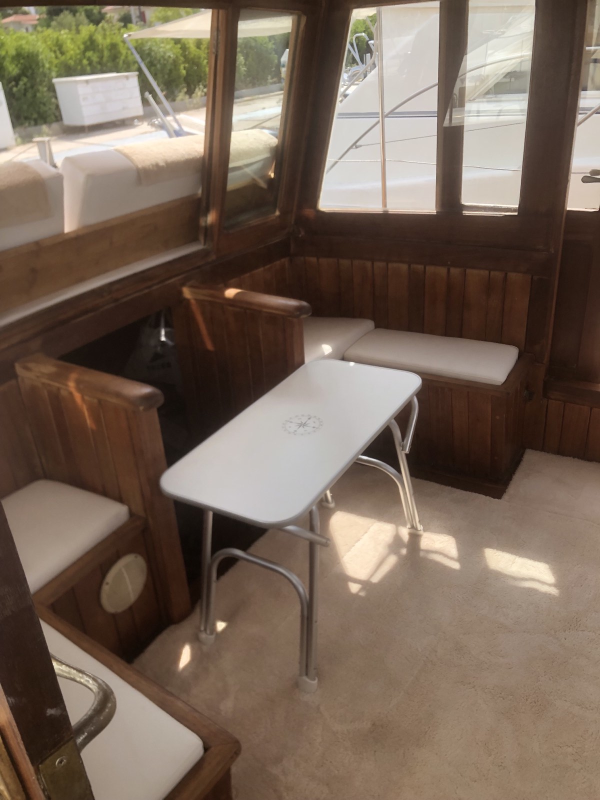 Wooden saloon with bench seating around a white table